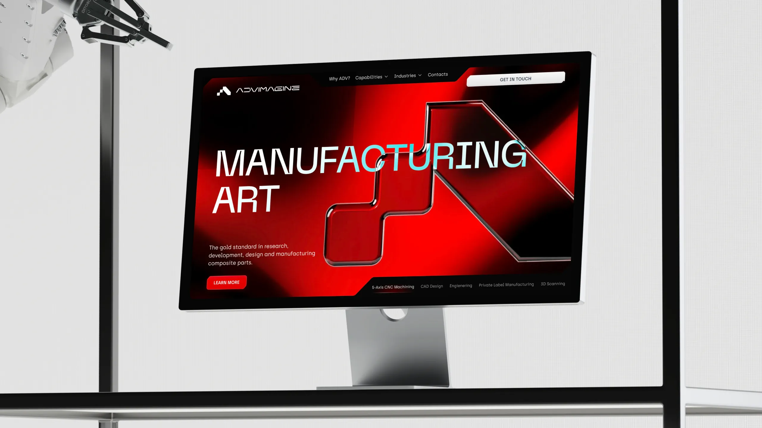 Website hero section on a deep red background with a glossy black 3D arrow mark. Large headline reads "Manufacturing Art," with a subhead about cutting-edge R&D, precision design, and composite manufacturing.