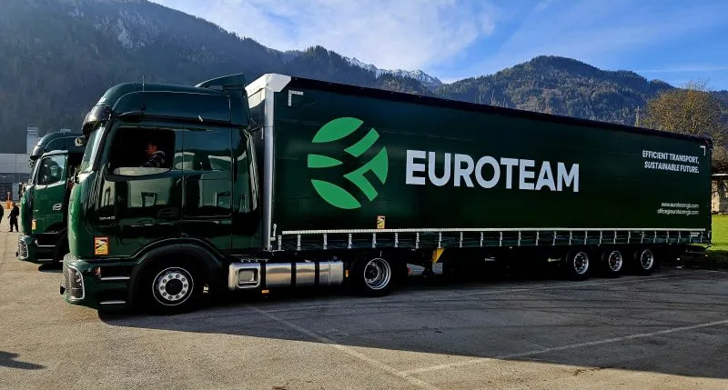 Euroteam brand identity on a fleet truck driving across Europe. Romanian international transport and logistics company, by WeGrow.